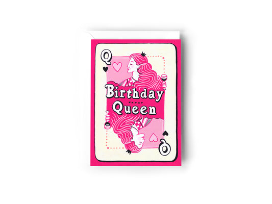 A Birthday Card design hand painted by Australian Artist Jessica Alpert. The card mimics a queen of hearts playing card design, but twists it in a fun modern way. A woman drinking wine is painted in place of the queen, and the words 'Birthday Queen' centre the design. The colour palette consists of baby pink, hot pink, white, black and cream. The card has a white envelope behind it and sits on a white background.