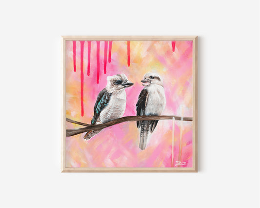 A Fine Art Print by Australian Artist Jessica Alpert of two Kookaburras perched on a branch against a textured pink, orange and yellow background. Hot pink drips of paint drip down from the top of the canvas.