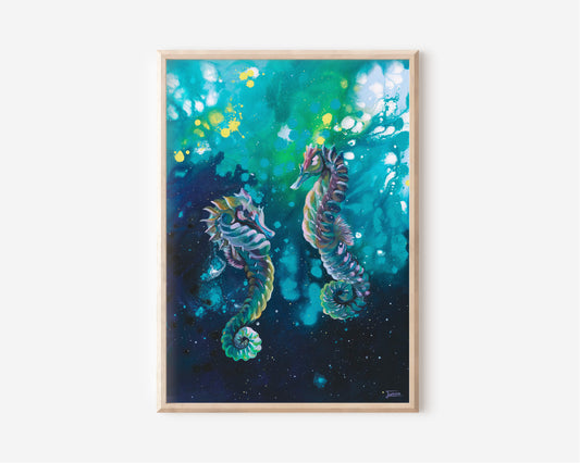 A Fine Art Print hand painted by Australian Artist Jessica Alpert of two colourful seahorse. The seahorse are floating amongst an abstract background of navy, turquoise, greens, yellow and white. Vibrant droplets and splashes of paint cover the canvas giving an abstract and whimsical appeal to the painting.