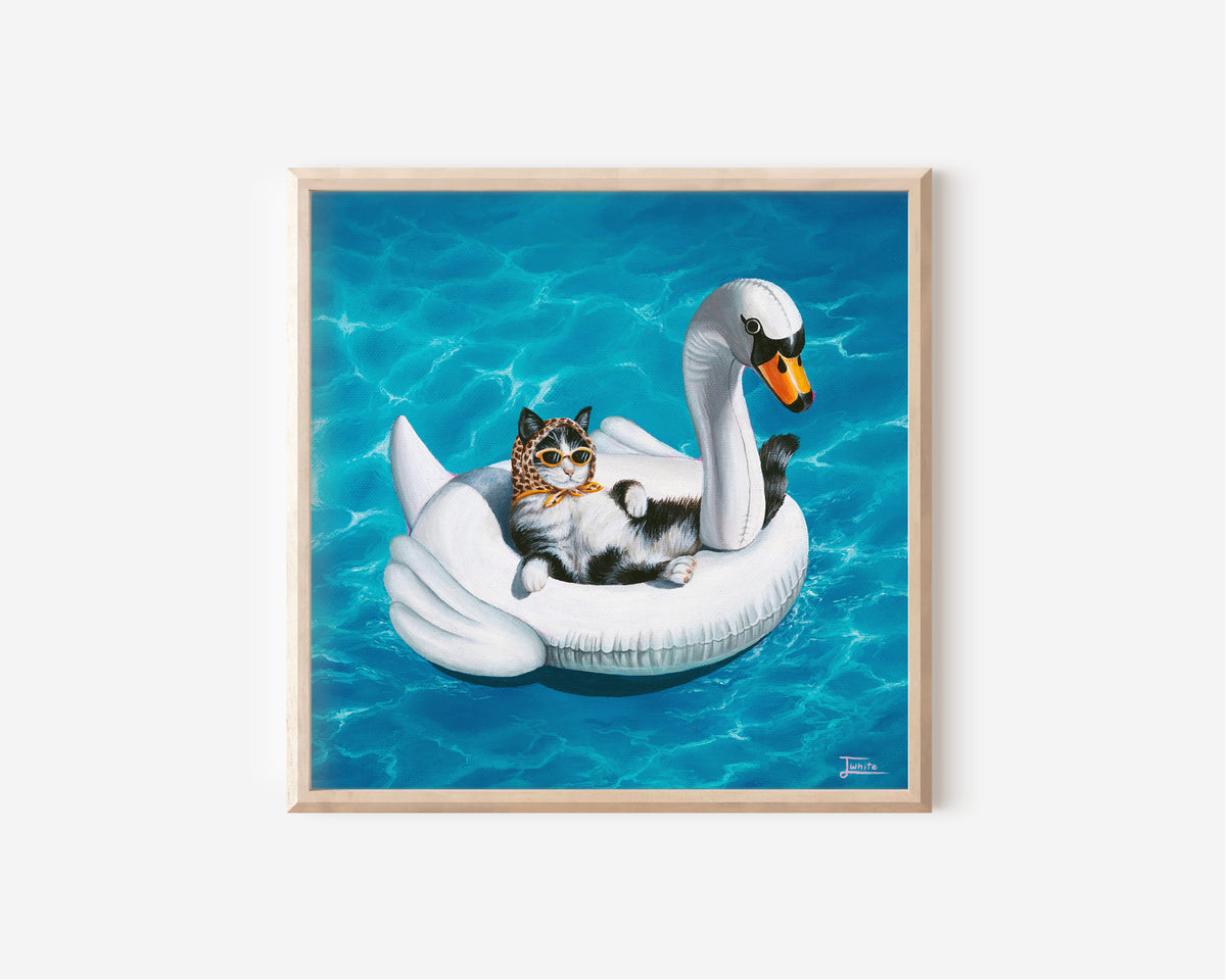 Fine Art Print by Australian Artist Jessica Alpert of a black and white fluffy tuxedo cat, wearing vibrant orange sunglasses and a leopard print bandana on it's head, laying on it's back comfortably in an inflatable white swan pool floaty, floating on vibrant, sparkly blue water.