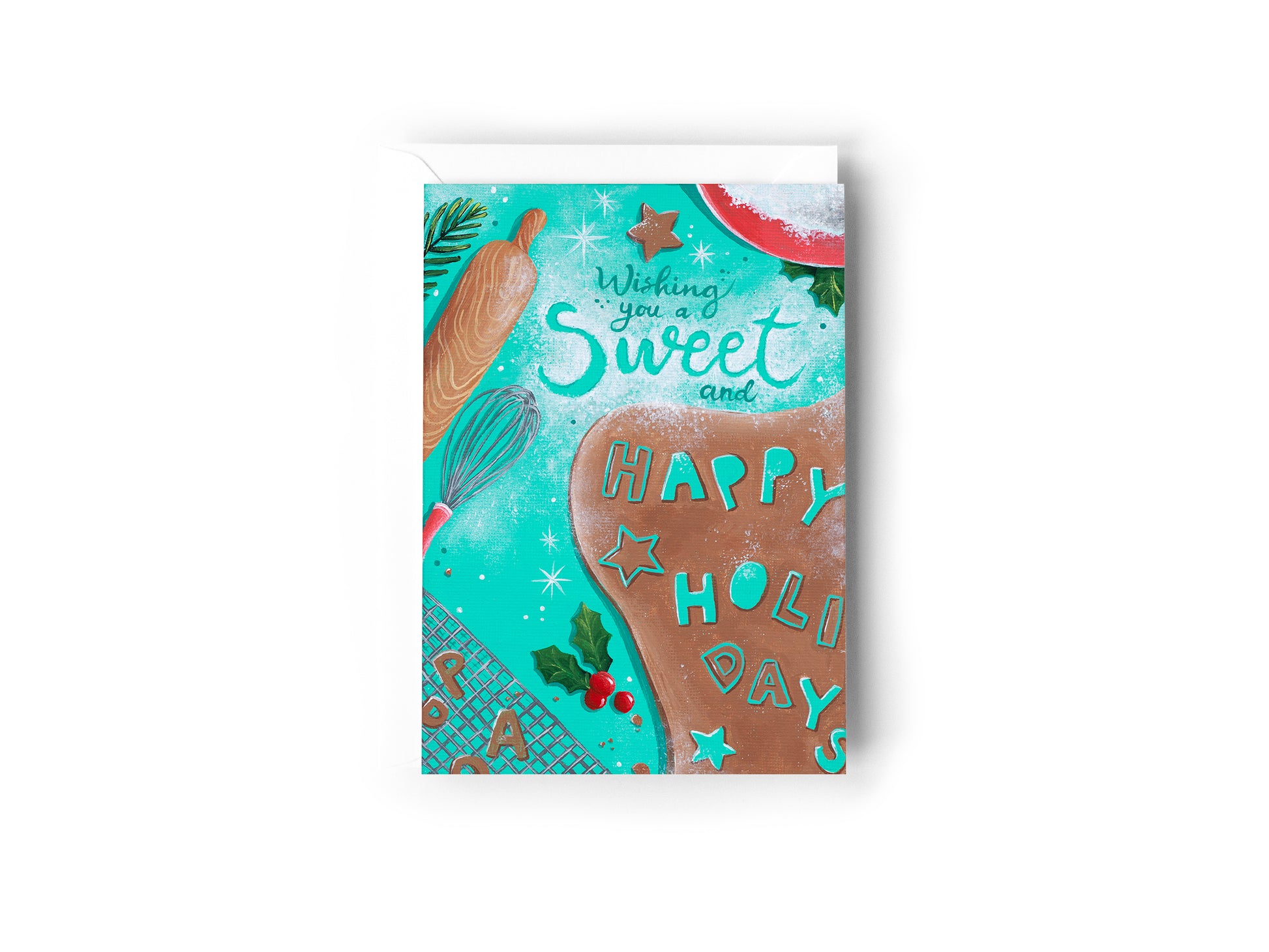 A festive Christmas greeting card featuring a turquoise background with illustrations of a gingerbread cookie, a rolling pin, a whisk, holly, and the words 'Wishing you a Sweet and HAPPY HOLIDAYS' by Australian Artist Jessica Alpert. The card has a white envelope behind it and sits on a white background.